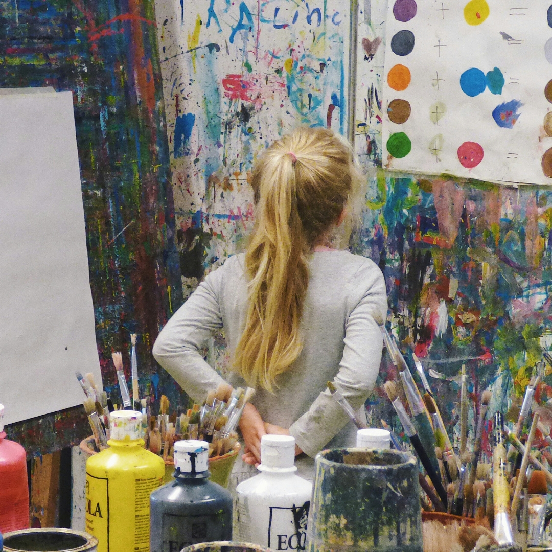 Student Artist looking at painting 